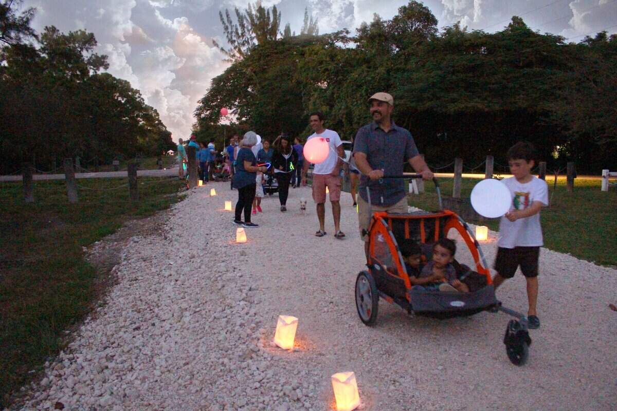 Visitors walk along the course of the planned Ludlam Trail during a Festival of Lights in 2015.